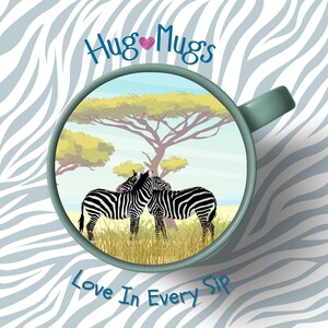 May include: A teal mug with a savanna scene featuring two zebras, a tree, and the text "Hug Mugs Love In Every Sip". The mug has a white and blue zebra stripe background.