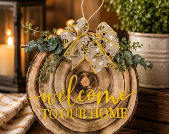 Rustic Welcome to Our Home Wood Slice Door Hanger | Farmhouse Front Door Sign | Bee Bow Wood Round Decor | Housewarming Gift | Wall Hanging