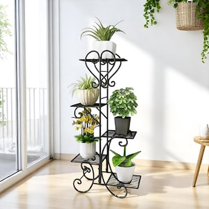 May include: Black metal plant stand with five tiers, featuring a decorative scroll design. The stand is filled with potted plants, including a succulent, a fern, and a flowering plant.