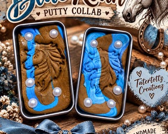 May include: Two rectangular metal tins filled with blue and brown swirled putty, each featuring a molded horse head design and embedded white pearl beads. The text reads Blue Roan Putty Collab, Tatertotz Creationz, and Handmade Putty for Diamond Painters.