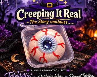 May include: A round, off-white eyeball-shaped object with red vein details and a dark blue faceted gem center, housed in a clear plastic container. The text reads Creeping It Real - The Story continues, Tatertottz Creationz, Christopher Kolasa, and Diamond Painting with NMD.
