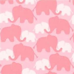 May include: Pink and white elephant pattern on a pink background. The elephants are in a repeating pattern, with larger pink elephants and smaller white elephants. The fabric has a textured appearance.