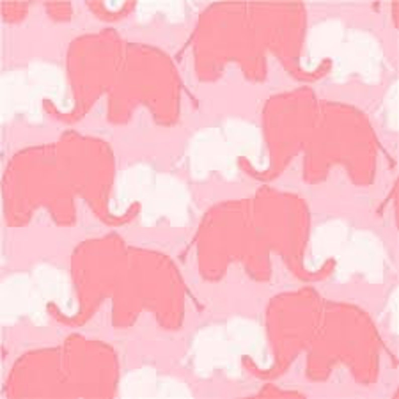 May include: Pink and white elephant pattern on a pink background. The elephants are in a repeating pattern, with larger pink elephants and smaller white elephants. The fabric has a textured appearance.