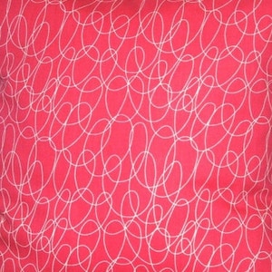 May include: A square, red cushion cover with a white, abstract scribble pattern. The design features continuous, looping lines that create a dynamic and modern aesthetic. The cushion cover is likely made of fabric.