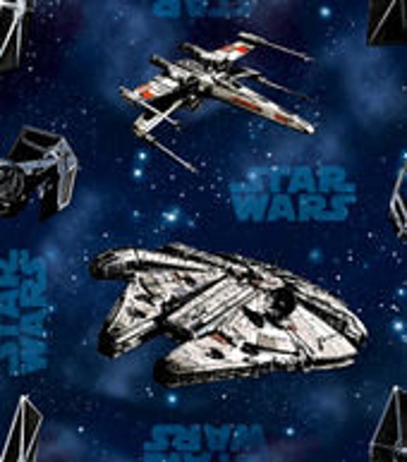 May include: A blue and white space-themed fabric with images of the Millennium Falcon, X-Wing, and TIE Fighter spaceships. The fabric also features the text "STAR WARS" repeated throughout.