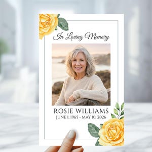 May include: A white ceramic mug with a black handle and the text "But First, Coffee" in a handwritten style. The mug is on a white surface. The mug is 4 inches tall.