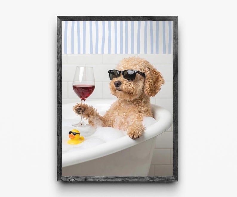 May include: A framed print features a dog in a bathtub wearing sunglasses and holding a glass of red wine. A yellow rubber ducky with sunglasses floats in the bubbles. The background has a blue and white striped pattern.