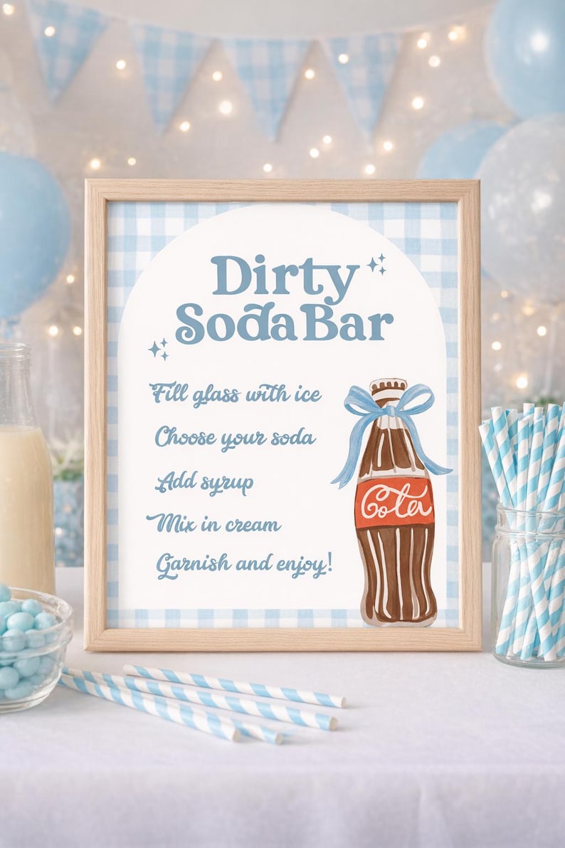 May include: A framed sign with the text "Dirty Soda Bar" in blue script. The sign includes instructions and a cola bottle illustration. The background is a light blue gingham pattern, with blue and white striped straws.