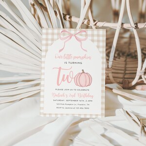 May include: A light pink and tan gingham patterned invitation card with a pink bow and pumpkin illustration. The text reads "Our little pumpkin is turning two" and invites guests to Daliah's 2nd birthday.