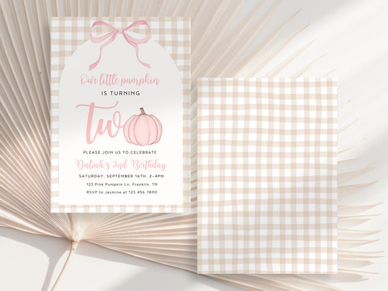 May include: A two-sided invitation with a pink pumpkin graphic and the text "Our little pumpkin is turning two." The invitation features a pink bow and a gingham pattern background. The text includes the date, time, and location of the birthday party.