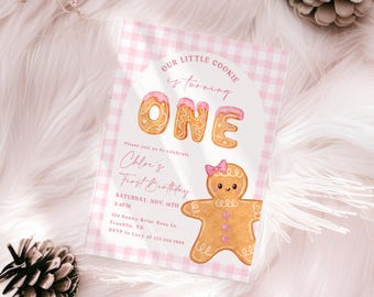 May include: A pink and white gingham-patterned invitation for a first birthday. The text "OUR LITTLE COOKIE is turning ONE" is displayed in pink. A gingerbread man graphic with a pink bow is featured. The invitation includes event details.