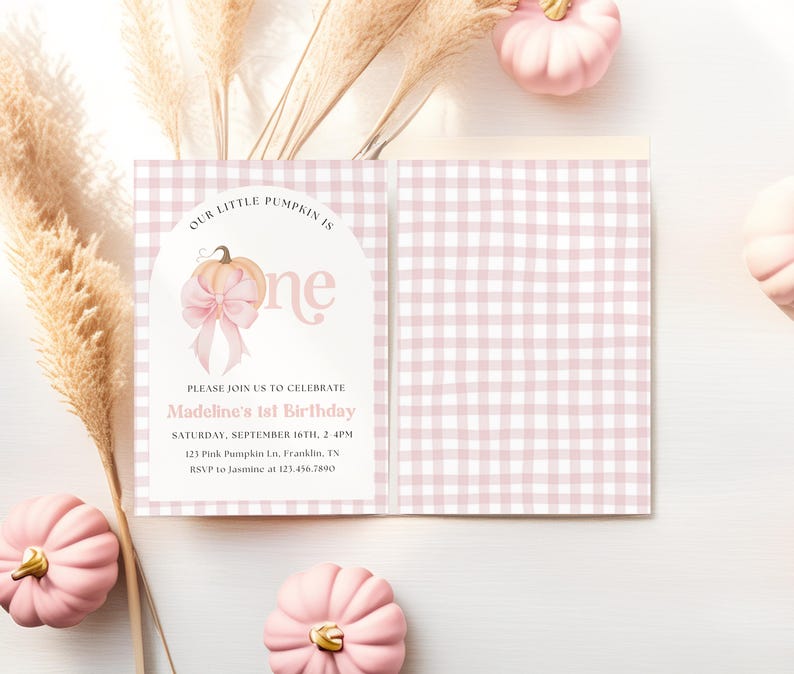 May include: A pink and white gingham patterned invitation with the text "Our Little Pumpkin is One" and "Madeline's 1st Birthday". The invitation features a pumpkin graphic with a bow. Pink pumpkins and pampas grass are in the background.