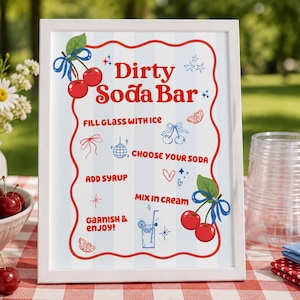 May include: A white framed sign with a light blue striped background featuring the red text Dirty Soda Bar. The sign includes instructions: Fill glass with ice, Choose your soda, Add syrup, Mix in cream, and Garnish & enjoy, with red cherry illustrations.