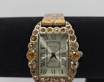 HEIDI DAUS Shimmering Serpent Topaz Swarovski Crystal and Leather Band Watch