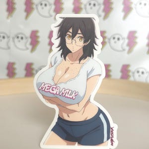 May include: A sticker featuring an anime-style illustration of a person wearing a white t-shirt with "MEGA MILK" in pink text, and navy blue shorts. The person has dark hair, glasses, and is standing on a wooden surface. The background has a pattern of pink lightning bolts and white ghosts.