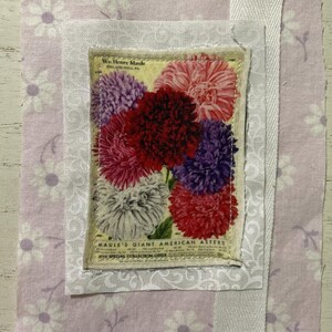 May include: A fabric collage featuring a central rectangular patch with a vintage botanical print of red, purple, and white aster flowers. The text reads "Wm. Henry Maule" and "Maule's Giant American Asters." It is layered on light purple floral fabric.