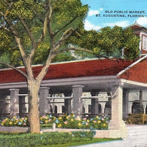 May include: A red-roofed building with white columns and a bell tower. The building is surrounded by lush green trees and flowers. The text "OLD PUBLIC MARKET, ST. AUGUSTINE, FLORIDA - 92K" is visible on the building.