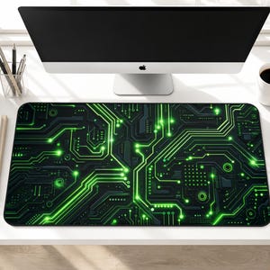 May include: A rectangular desk mat featuring a dark gray and black background with a vibrant neon green circuit board pattern. The design displays intricate interconnected lines, nodes, and geometric shapes that mimic electronic pathways.