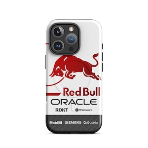 May include: White phone case with the Red Bull logo, a red bull graphic, and the words "Red Bull Oracle". The case also displays the names "ROKT", "1Password", "Mobil 1", "SIEMENS", and "Gate.io".