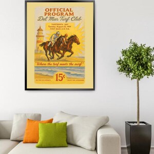 May include: A vintage poster advertising the Del Mar Turf Club, a horse racing track in California. The poster features a yellow background with a sunburst design, a lighthouse, and two horses racing on the beach. The text reads "Official Program Del Mar Turf Club Thirteenth Day Tuesday, August 22, 1939 First Race 2:15 PM. "Where the turf meets the surf" 15¢".