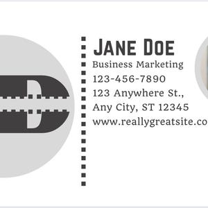 May include: A business card design with the initials "JD" in a grey circle. The card includes contact details for Jane Doe, such as a phone number and website address. A photo of a woman is in a circular frame.