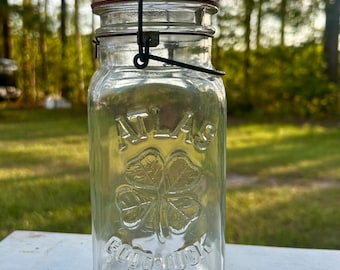 Tarro de cristal Atlas Good Luck Clover de un cuarto de galón, color avellana, Atlas de la década de 1920, cierre de alambre, junta de tapa original.