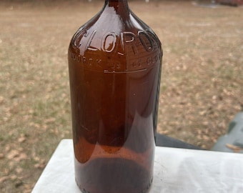Extremely rare Vintage Brown Glass Clorox Cork Top Bottle 7.5 in Large Gorgeous Home Decor. First year of issue! Great collectible bottle.