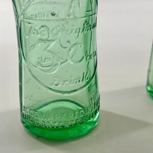 Close-up of raised 3 Centa lettering above the textured aqua glass heel.