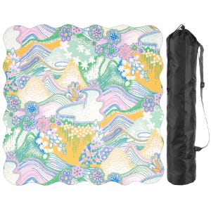 May include: A colorful, patterned mat with a wavy edge, featuring a landscape design with mountains, flowers, and flowing lines in shades of yellow, pink, blue, and green. A black carrying bag is included.