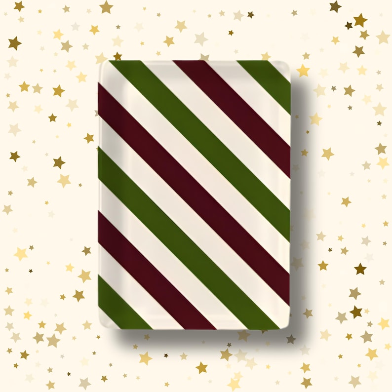 May include: A rectangular tray featuring a repeating diagonal striped pattern in dark forest green, deep burgundy, and off-white. The tray has a smooth, glossy finish with rounded corners, presenting a clean, symmetrical design across its surface.
