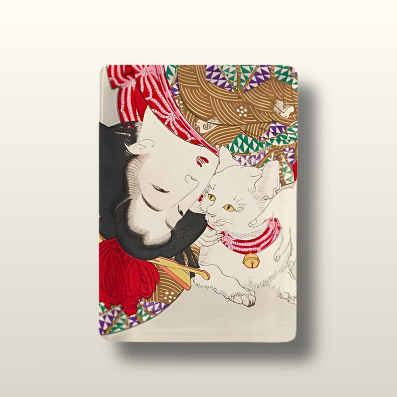 May include: A rectangular ceramic tray featuring a stylised illustration of a person with dark hair and a red headpiece resting next to a white cat wearing a red collar with a gold bell. The background includes brown and green geometric patterns.