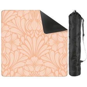 May include: A peach-colored floral patterned mat with a black underside and a black carrying bag. The mat features a symmetrical design of stylized leaves and petals. The bag has a shoulder strap for easy carrying.