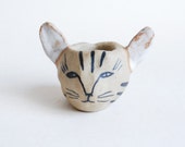 Cat ceramic candle holder in tan, blue-black, and white