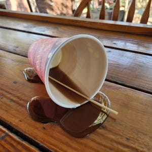 Realistic fake coffee cup spill by Dead Head Props, Great as as a gag gift or prank!