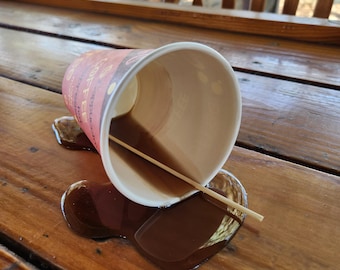Realistic fake coffee cup spill by Dead Head Props, Great as as a gag gift or prank!