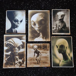 May include: A collection of six vintage photographs featuring grayscale images of alien-like creatures with large heads and eyes. The images are printed on paper with a textured surface and have a faded, antique look.