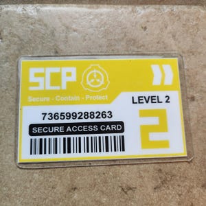 May include: A yellow and white Secure Access Card with the text "SCP" and "Secure - Contain - Protect". The card also displays "LEVEL 2", a barcode, and a long numerical sequence.