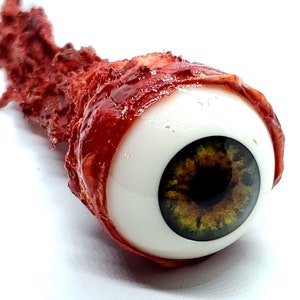 Accesorio de Halloween: horror realista de tamaño natural arrancado del globo ocular marrón/verde