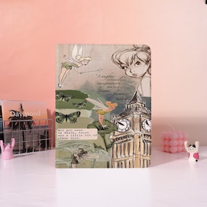 May include: A decorative journal featuring illustrations of Tinkerbell, butterflies, and Big Ben. The journal has the quote "Laughter is timeless, imagination has no age, dreams are forever." and the text "All you need is faith, trust and a little bit of pixie dust."