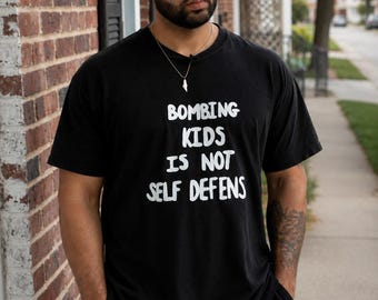 Bombing Kids Is Not Self Defense Shirt, Anti War Graphic Tee, Peace Message T-Shirt, Human Rights Protest Shirt