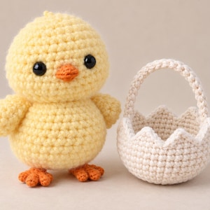 May include: A yellow crocheted chick toy with black plastic eyes and an orange beak and feet, positioned next to a small, off-white crocheted basket with a scalloped rim and a handle, both crafted with a visible yarn stitch texture.