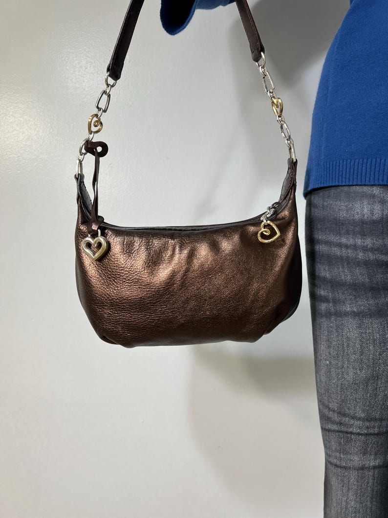 May include: A rustic wooden sign with the text "Welcome to our home" in white lettering. The sign features a distressed finish and a simple, inviting design, perfect for front door decor.