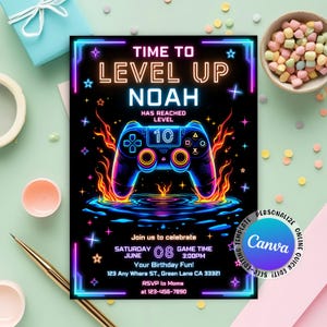 May include: Black invitation with neon text and graphics for a birthday party. The text reads "Time to Level Up Noah" with a game controller graphic. The invitation includes the date, time, and location of the party.