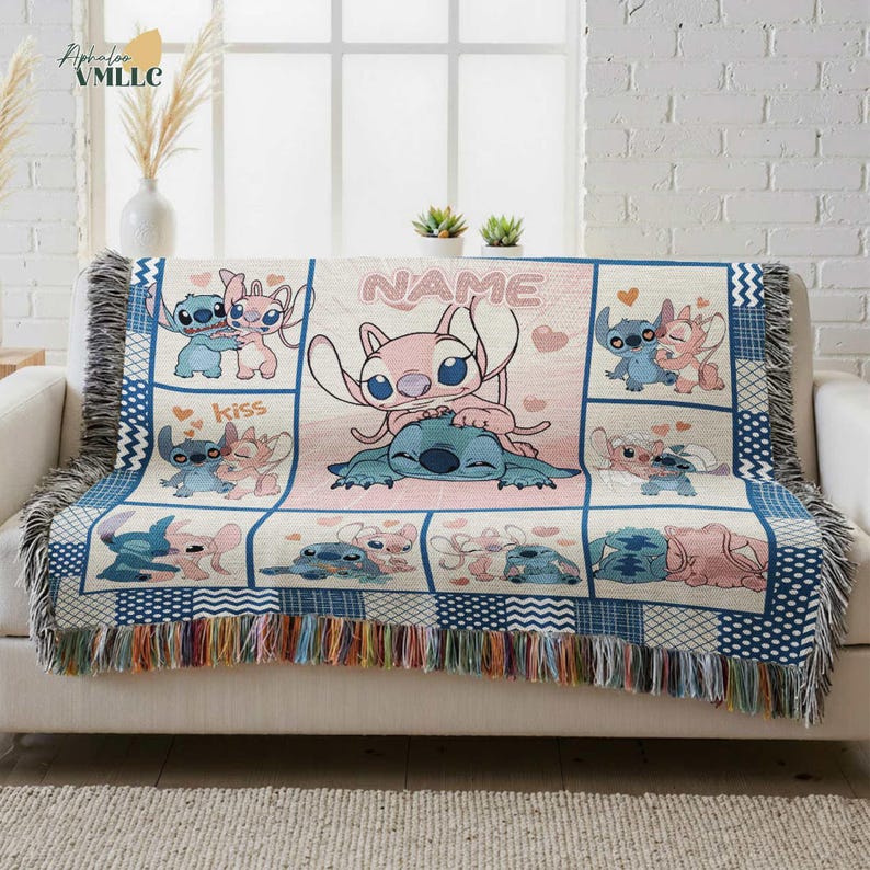 a cozy and colorful throw blanket with a cartoon character design, placed on a couch in a room with a window and some decorative elements.