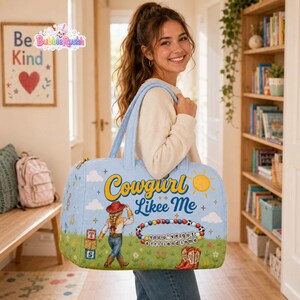 May include: A light blue duffel bag featuring the text Cowgirl Likee Me, a graphic of a cowgirl, a sun, musical notes, alphabet blocks, a beaded bracelet with the text You've got a friend in me, and a pair of red cowboy boots on a grassy field.