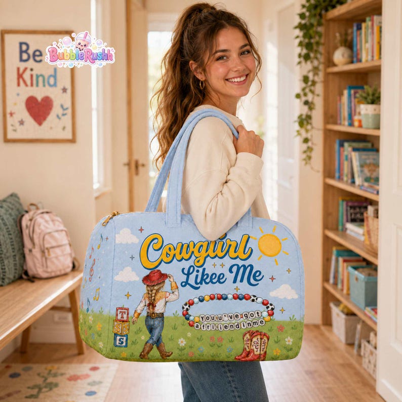 May include: A light blue duffel bag featuring the text Cowgirl Likee Me, a graphic of a cowgirl, a sun, musical notes, alphabet blocks, a beaded bracelet with the text You've got a friend in me, and a pair of red cowboy boots on a grassy field.