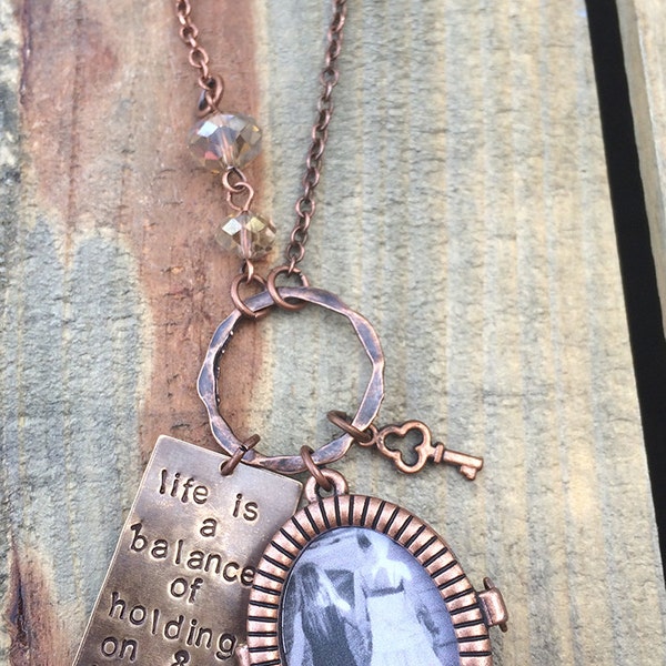 Limited edition locket design -  long antiqued copper style. Life is a balance of holding on and letting go