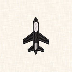 May include: A black embroidered airplane patch with white accents on the body and tail. The patch features a detailed design of an airplane with wings and a tail, set against a cream-colored fabric background.