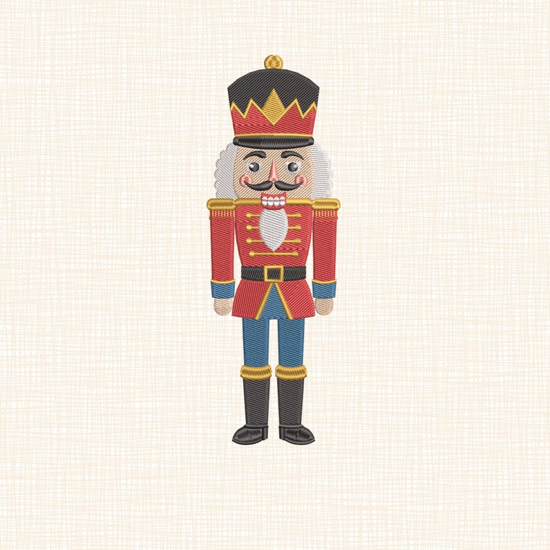 May include: Embroidered image of a traditional nutcracker soldier. The nutcracker is dressed in a red coat with gold trim, blue pants, and black boots. It has a black hat with gold accents, a white beard, and a handlebar mustache.
