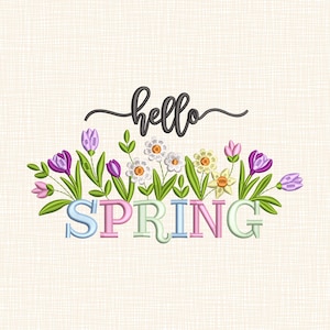 May include: Embroidered design with the word "SPRING" in pastel colours, and "hello" in cursive above. The design includes various flowers in shades of purple, white, and yellow, with green leaves, set against a textured background.